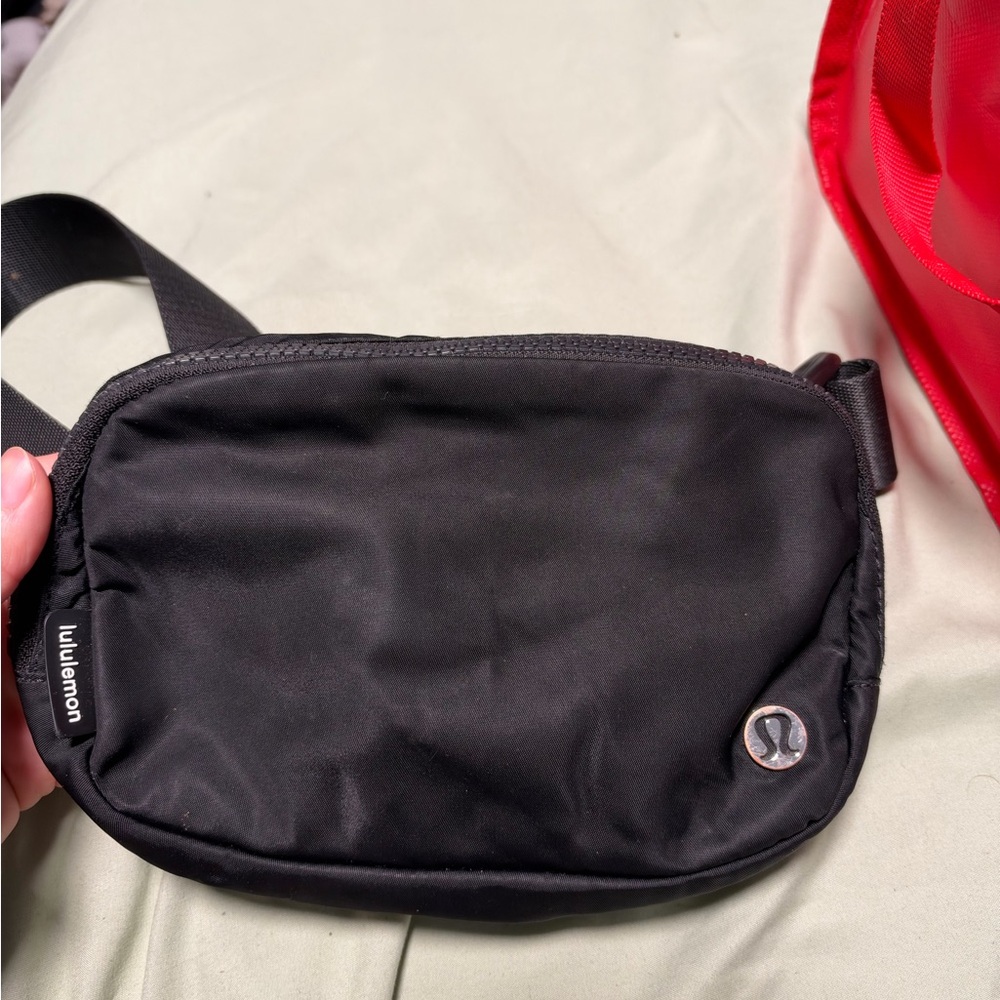 lululemon black belt bag with silver logo
